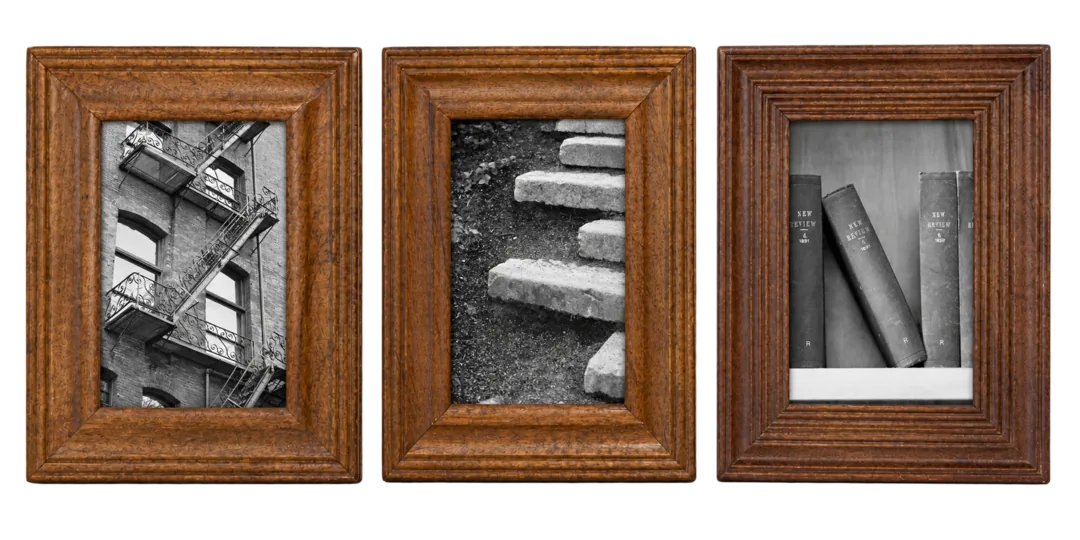ZEN spelled from found letters — a fire escape, garden steps, leaning books — in three individual dark-wood frames.